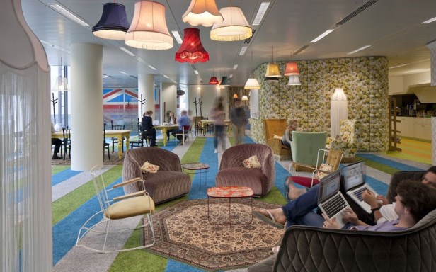 Google headquarters, Central Saint Giles, Covent Garden, London, Britain - 06 Aug 2012...Must credit PENSON/Rex Features Mandatory Credit: Photo by PENSON / Rex Features (1811356e) Seating area A Peek Inside Google's London Headquarters It features a secret garden, 'Granny flat' interiors and an allotment - welcome to Google's new London headquarters. The 160,000 sq ft hub features cutting-edge design that offers a quirky take on the traditional office. Occupying half of the ultra-modern Central Saint Giles development in Covent Garden over five floors, renowned interior designers PENSON were given the task of creating a vibrant workspace. The result is amazing variation of work and lounging space which finds room for 1,250 non-traditional desks. A space called Granny's Flat is furnished with chintzy chairs and fittings that wouldn't look out of place in an elderly relative's lounge, while the Lala Library hosts a giant semi-circle white sofa adorned with pillows and surrounded by arty and inspirational books. Surreal workspaces have tongue-in-cheek names such as the Velourmptious snug, a green, padded homage to the traditional British pub, and Snug-lushness, a garish flower-print padded bench seat. An area dubbed the Town Hall allows seating for 200 people and features velvet curtains, exposed ceilings and a video wall, while the Market Square is a rustic cafeteria area. For active staff members there is a gym and dance studio, a 'bikedry' for cycling gear storage and a shower block for those sweaty from the morning workout, cycle or commute. For those really wanting to escape the office, a 'Hedge Your Bets' secret garden on the roof terrace affords stunning views of London surrounded by grass and foliage - all with wi-fi connection for laptop work. Eco considerations are at the forefront of design with a high content of reclaimed or recycled materials employed and the use of water-based products and timber floor boards with Eco plywo